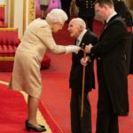 The Queen, 93, dons gloves at an investiture for first time ever to shake hands with medal recipients amid coronavirus crisis (but Prince Charles, William and Kate have bare hands at their engagements)